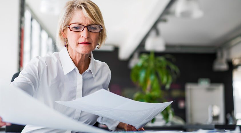 Woman reading papers