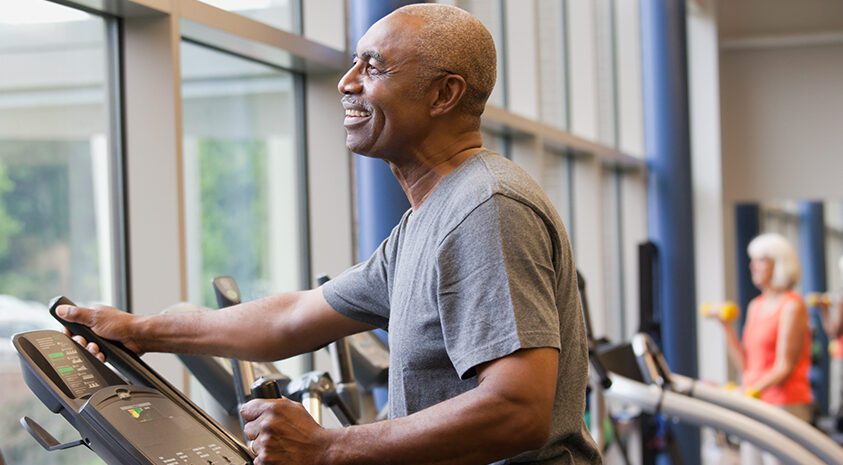 Man exercising on elliptical