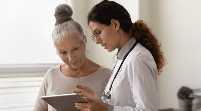Woman patient reviewing iPad with Doctor