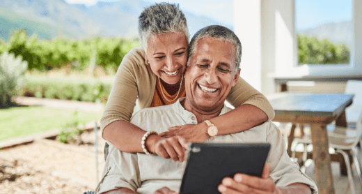 Retired couple reviewing iPad together