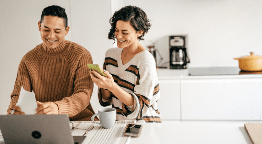 Couple budgeting in kitchen together