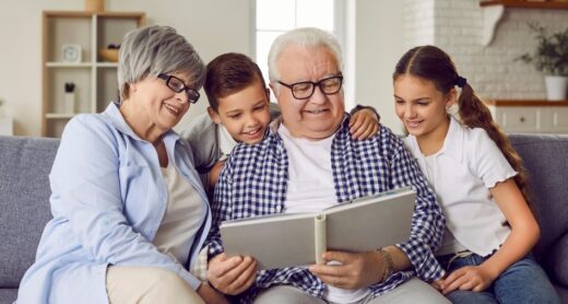 Grandparents read a story to their grandchildren.