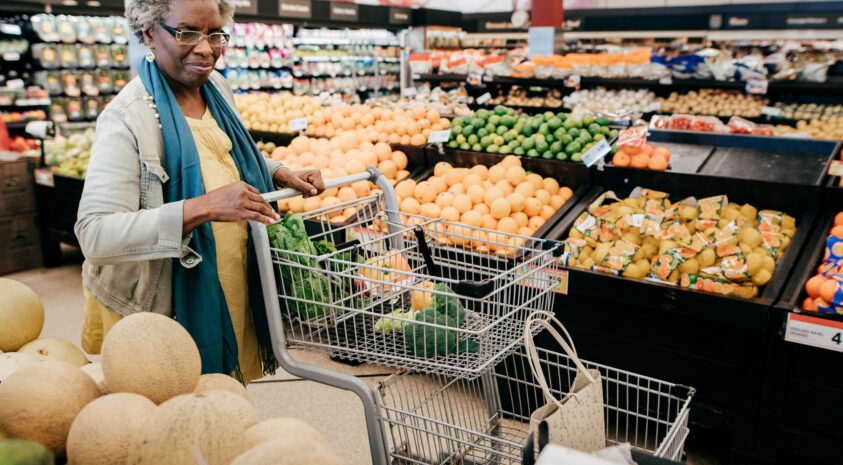 Senior woman grocery shopping.