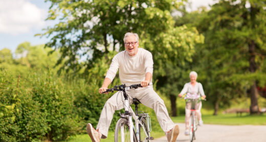 A senior couple riding bikes.
