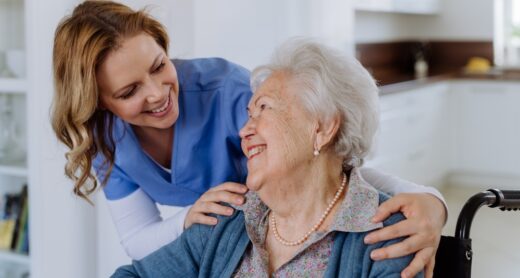 Nurse and senior client in a wheelchair.