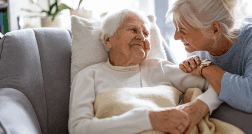 Senior woman looking at caregiver.