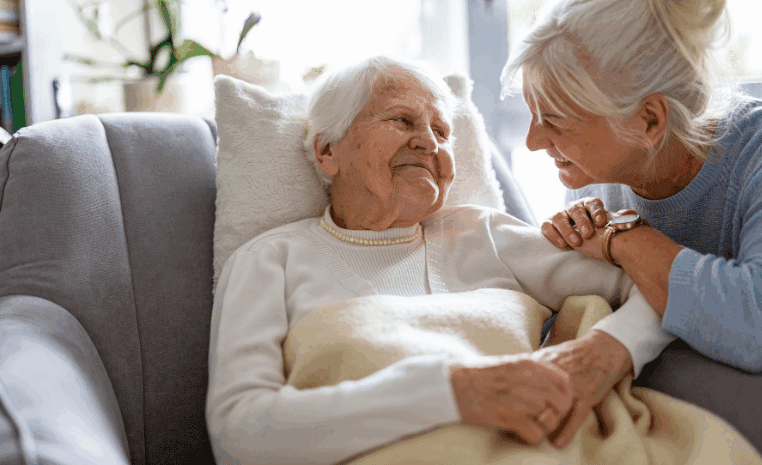 Senior woman looking at caregiver.